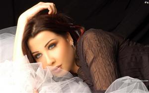 Blue-eyed Nancy Ajram, a Lebanese singer and recording artist in a killer pose